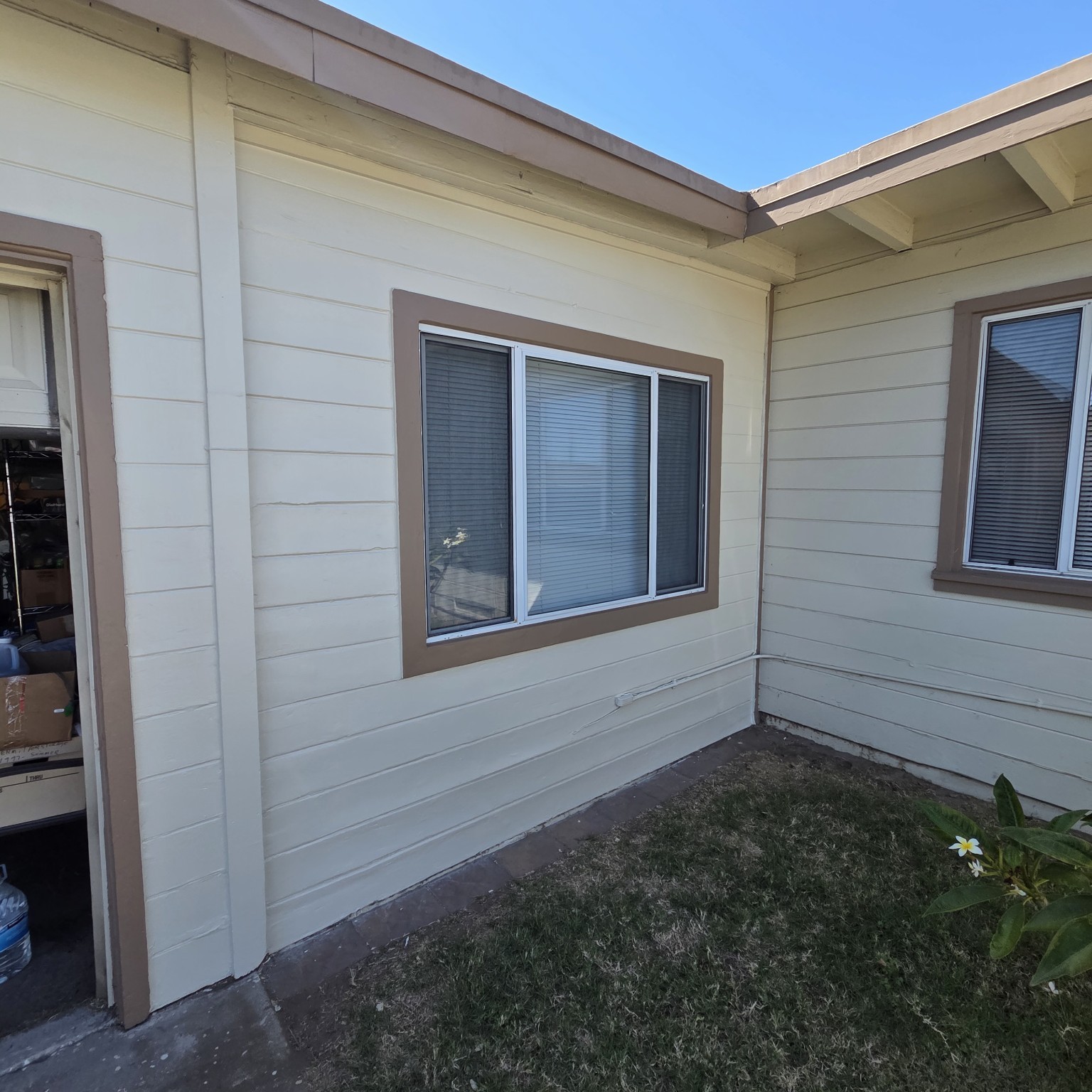 Finished exterior siding and trim painting