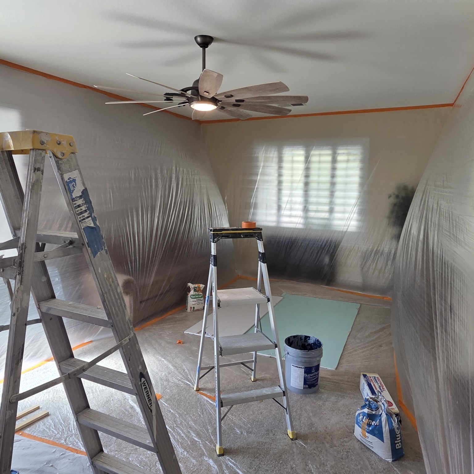 Interior room carefully masked and protected for painting