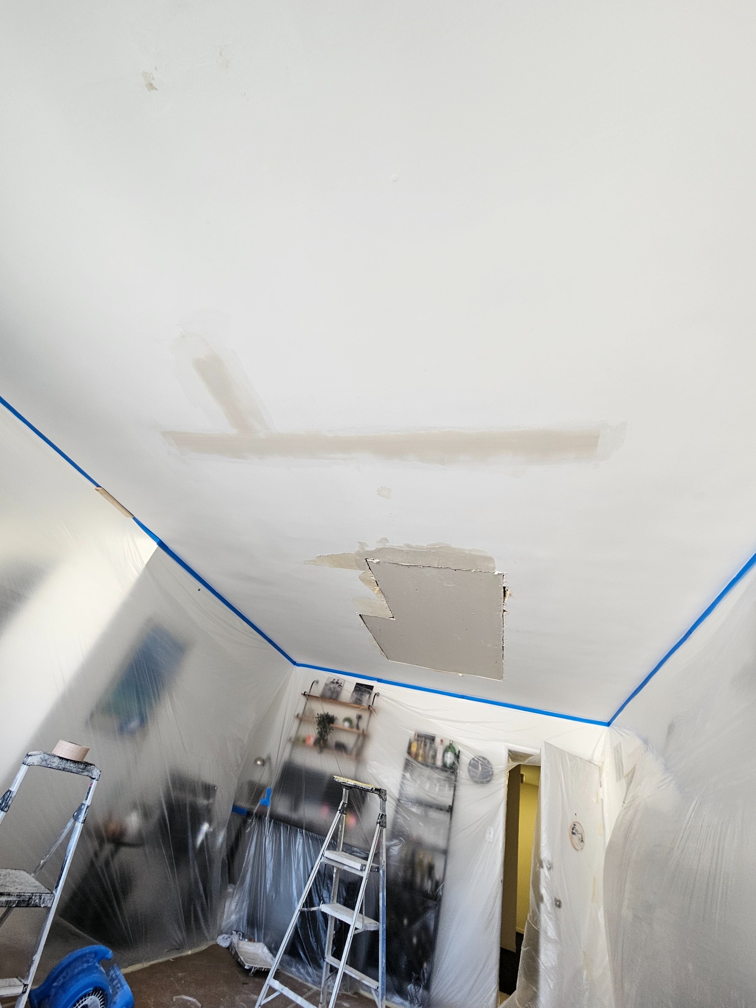 Drywall repair and finish preparation after restoration